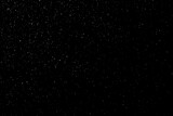 Fototapeta Kosmos - Abstract black background with sparkles and shadows. Fluidity, waves, glitter, fluid, glitter, shimmer. Stars, stardust, space, outer space, comets, placer.