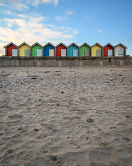 Poster - Sandy Beach below Blyth Beach Huts, situated on the promenade these colourful Beach Huts overlook the sandy beach and North Sea on the Northumberland coastline