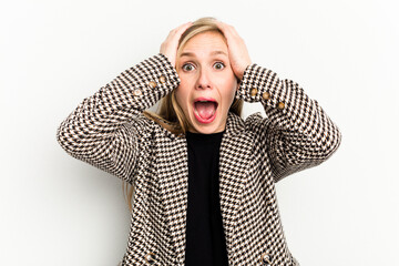 Wall Mural - Young caucasian woman isolated on white background screaming, very excited, passionate, satisfied with something.