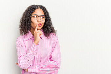 Wall Mural - Young african american woman isolated on white background looking sideways with doubtful and skeptical expression.