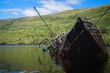 Wreck of a fishing boat on the shallows of Loch Oich near the ruins of Invergarry Castle