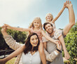 © Coetzee/peopleimages.com - Portrait, parents carry girls and in nature, quality time and bonding on weekend, happiness or playful. Love, mother and father with daughters on shoulder, outdoor or family on break, relax or loving