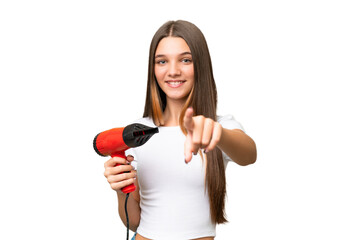 Canvas Print - Teenager Caucasian girl holding a hairdryer over isolated background points finger at you with a confident expression