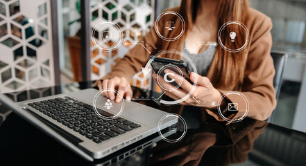 Wall Mural - Copyright or patent concept, Person hand using laptop computer, tablet and smartphone with virtual screen copyright icon trademark, Creation ownership against piracy. at office