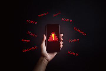 Fototapete - Scam alert on smartphone concept, virus hacker internet security, Businessman holding smart phone. Scam money from banking apps, Spam Email Pop-up Warning.