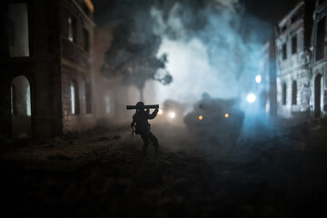 Military soldier silhouette with bazooka. War Concept. Military silhouettes fighting scene on war fog sky background, Soldier Silhouette aiming to the target at night.