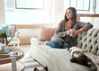 © Reese/peopleimages.com - Relax, morning tea and woman with dog on a home living room couch feeling calm with happy lifestyle. Happiness and smile of person with puppy thinking with coffee on peaceful lounge day in a house
