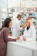© Reese/peopleimages.com - Wellness, health and happy pharmacy customer at store counter for medicine expertise with smile. Pharmaceutical advice and opinion of woman pharmacist helping girl with medication information.