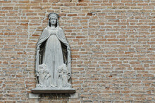 Religious bas-relief on the façade of the Scoletta dei Calegheri, historical seat of Venetian shoemakers, Venice, Veneto, Italy