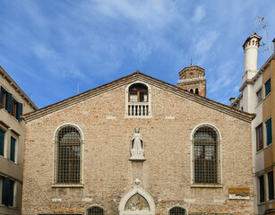 Wall Mural - High section of the façade of the Scoletta dei Calegheri, historical seat of Venetian shoemakers, San Polo sestiere, Venice, Veneto, Italy