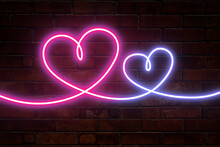 Neon Hearts In Pink And Blue On A Brick Wall Background. Two Hearts With Backlight. Glow Of The Heart.