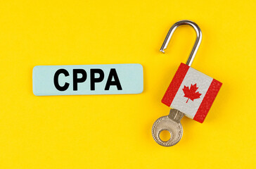 Poster - On the yellow surface is an open lock with a key and a sticker with the inscription - CPPA