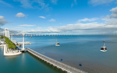 Canvas Print - telecabine lisboa at park of nations. vasco da gama tower and bridge in lisbon. cable car in the mod