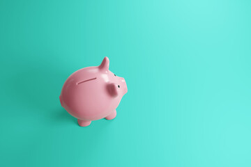 Pink ceramic piggy bank on plain cyan background. Illustration of the concept of financial investment, bank savings and economy