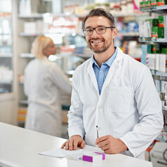Poster - Portrait, service and pharmacist man at counter for medicine help, expert advice and healthcare pharmacy. Retail desk, store and medical professional worker, doctor or person with a friendly smile