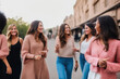 Candid photo of a group of girlfriends walking in the city, generative ai