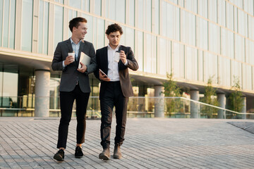 Wall Mural - Smart young businessmen are working on a startup going to the office. 