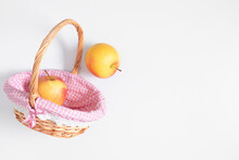Fruits Minimal Background. Top View Of Wicker Beautiful Basket With Two Juicy Ripe Apples On Isolated White Background, Flat Lay, Copy 