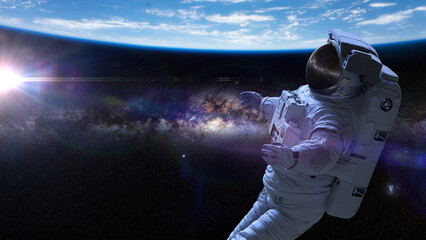 Wall Mural - astronaut during spacewalk in earth orbit