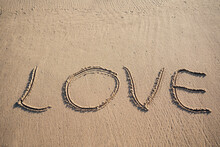 Written Word LOVE On Sand With Copy Space