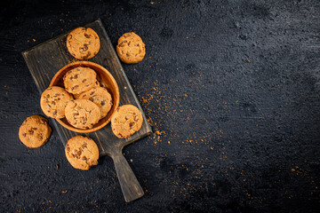 Wall Mural - Cookies with milk chocolate on a cutting board. 