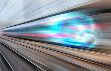 Wall Mural - Blue high speed train runs on rail tracks - The train is going too fast as a result the air pressure is causing too much heat at the front