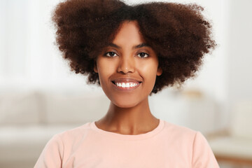 Wall Mural - Portrait of smiling African American woman at home