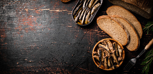 Poster - Sprats with slices of fresh bread. 