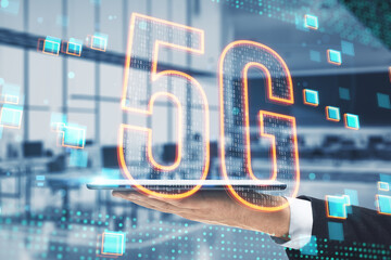Poster - businessman hand holding tablet with glowing 5g hologram on blurry office interior background. 5G network concept, high speed mobile internet, new generation networks. Mixed media. Double exposure.