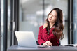 © wichayada - asian woman thinking hard concerned about online problem solution looking at laptop screen, worried serious asian businesswoman focused on solving difficult work computer task
