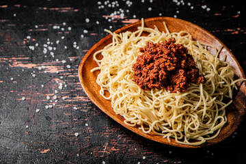 Canvas Print - Homemade spaghetti bolognese in a plate on the table. 