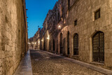 Fototapeta Uliczki - Medieval Street of the Knights called Ippoton with cobblestone road in Old town of Rhodes city in Rhodes island, Greece