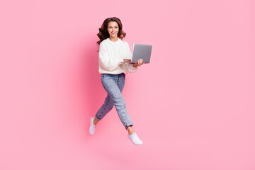 Wall Mural - Full length photo of shiny pretty woman dressed pullover communicating device empty space isolated pink color background