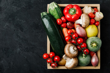 Wall Mural - Fresh vegetables wooden box. Organic zucchini, tomatoes, potatoes, paprika, onions, carrots, mushrooms in wooden box.