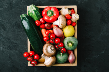 Wall Mural - Fresh vegetables wooden box. Organic zucchini, tomatoes, potatoes, paprika, onions, carrots, mushrooms in wooden box.