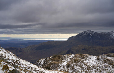 Wall Mural - The dark mountains summit of Wetherlan under a layer of cloud from Langdale Pikes in the Cumbrian Lake District Mountains, England UK.