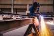 © sakarin14 - Welder use carbon air arc gouging for hot work cutting or gouging heavy metal steel structure in the fabrication factory.