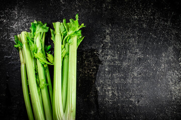 Canvas Print - Stalks of fresh celery on the table. 