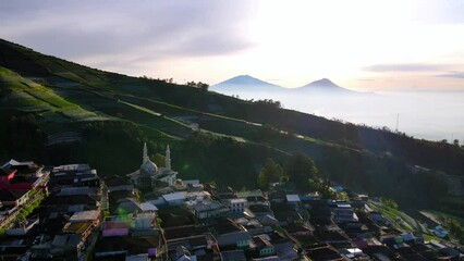 Wall Mural - Aerial view of beautiful Indonesian countryside called Nepal Van Java in the sunny morning - Slope of Mount Sumbing, Indonesia