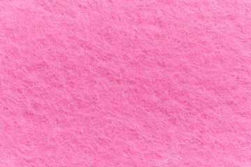 Soft felt textile material pink color, colorful texture flap fabric background closeup