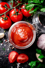 Poster - Tomato sauce in a glass jar with parsley and garlic. 