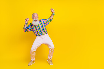 Poster - Full length photo of positive good mood guy dressed striped shirt dancing looking empty space isolated yellow color background