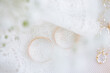 © ADDICTIVE STOCK - Golden wedding rings on lace fabric