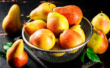 Poster - Ripe pears in a colander. 