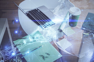 Poster - Computer on desktop in office with technology theme hologram. Double exposure. Tech concept.