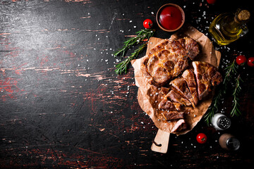 Canvas Print - Delicious grilled pork steak with tomato sauce and rosemary. 