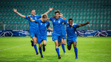 Fototapeta Sport - Soccer Football Championship: Blue Team Forward Attacks and Scores Goal, Win the Match, Players Happy, Celebrate Victory, Win Tournament. Sport Channel Broadcast Television Concept.