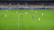 © Gorodenkoff - Soccer Football Championship Stadium with Crowd of Fans: Blue Team Attacks, Forward Dribbles, White Team Defending The Goals, Ready To Counterattack. Sports Channel Broadcast Television. High Angle.