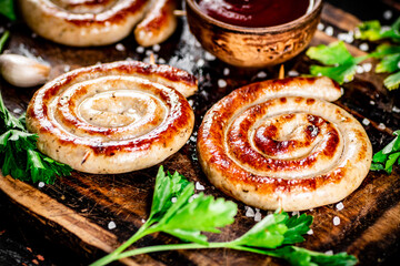 Poster - Grilled sausages with parsley on a wooden background.