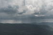 Widok w Bieszczadach z Połoniny Wetlińskiej. Ciemne burzowe chmury , oberwania chmury i nawałnica